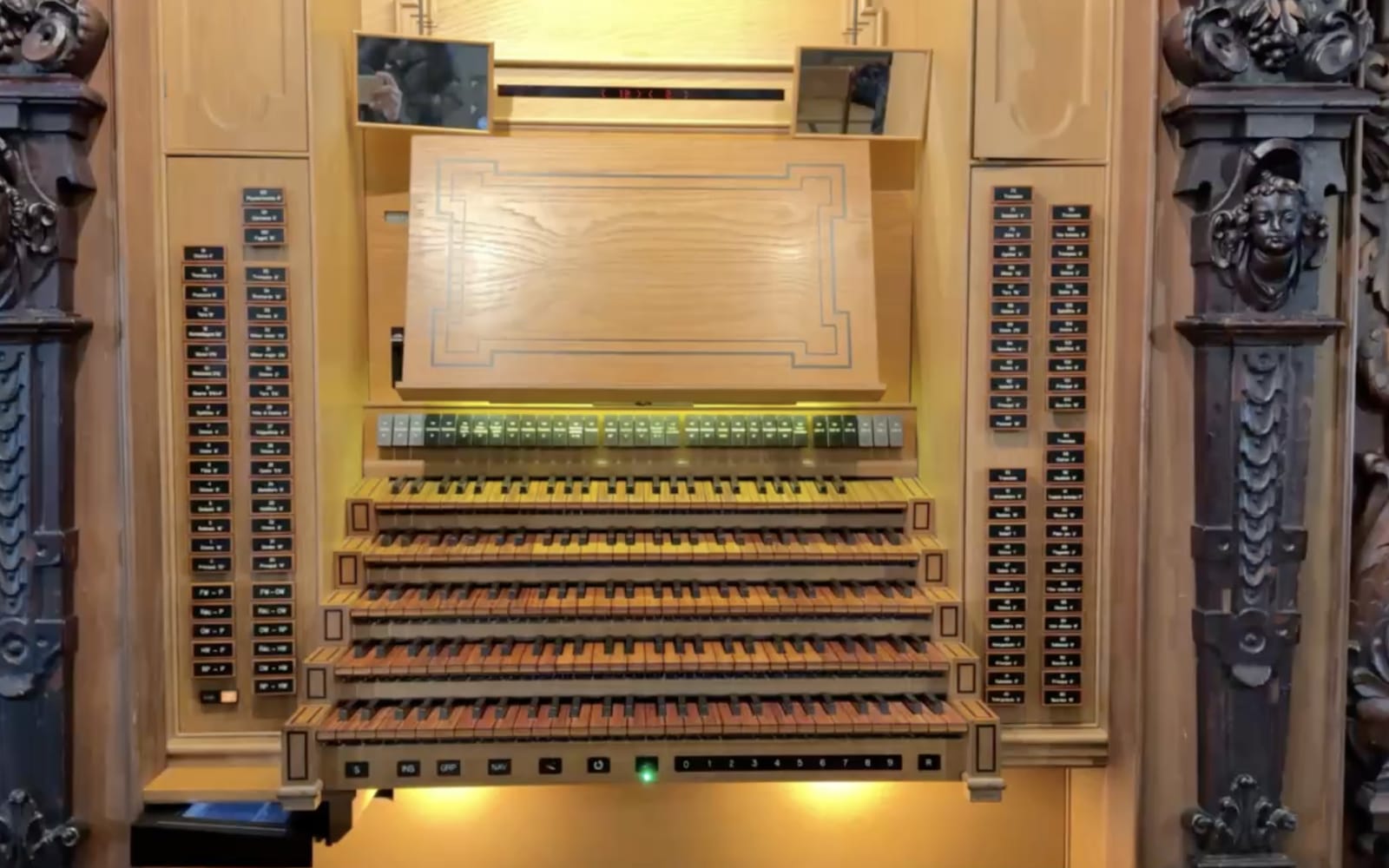 Playing the organ at the Hofkirche, St. Leodegar, Lucerne, Switzerland